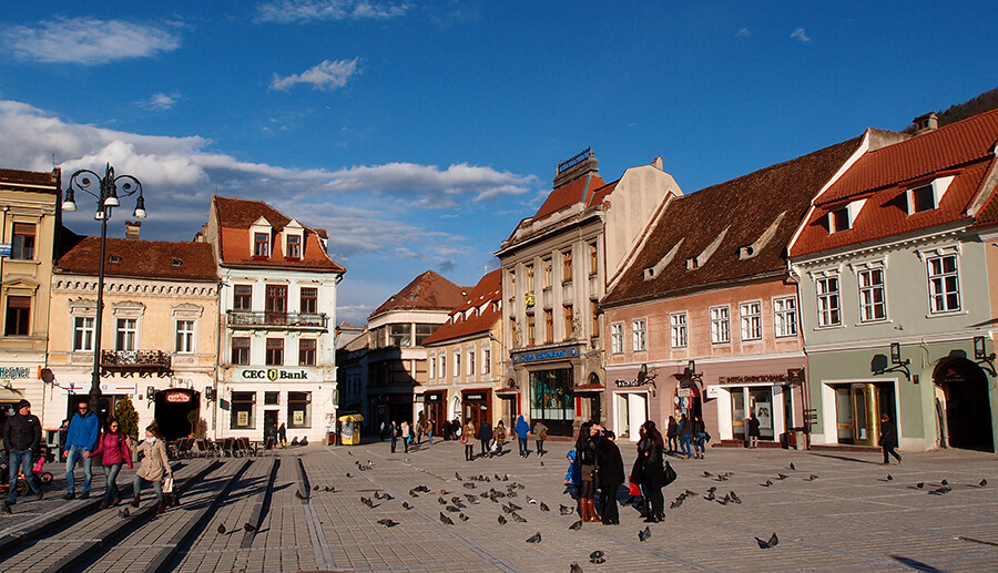 The picturesque Sfatului Square in Brasov, ringed by gothic buildings